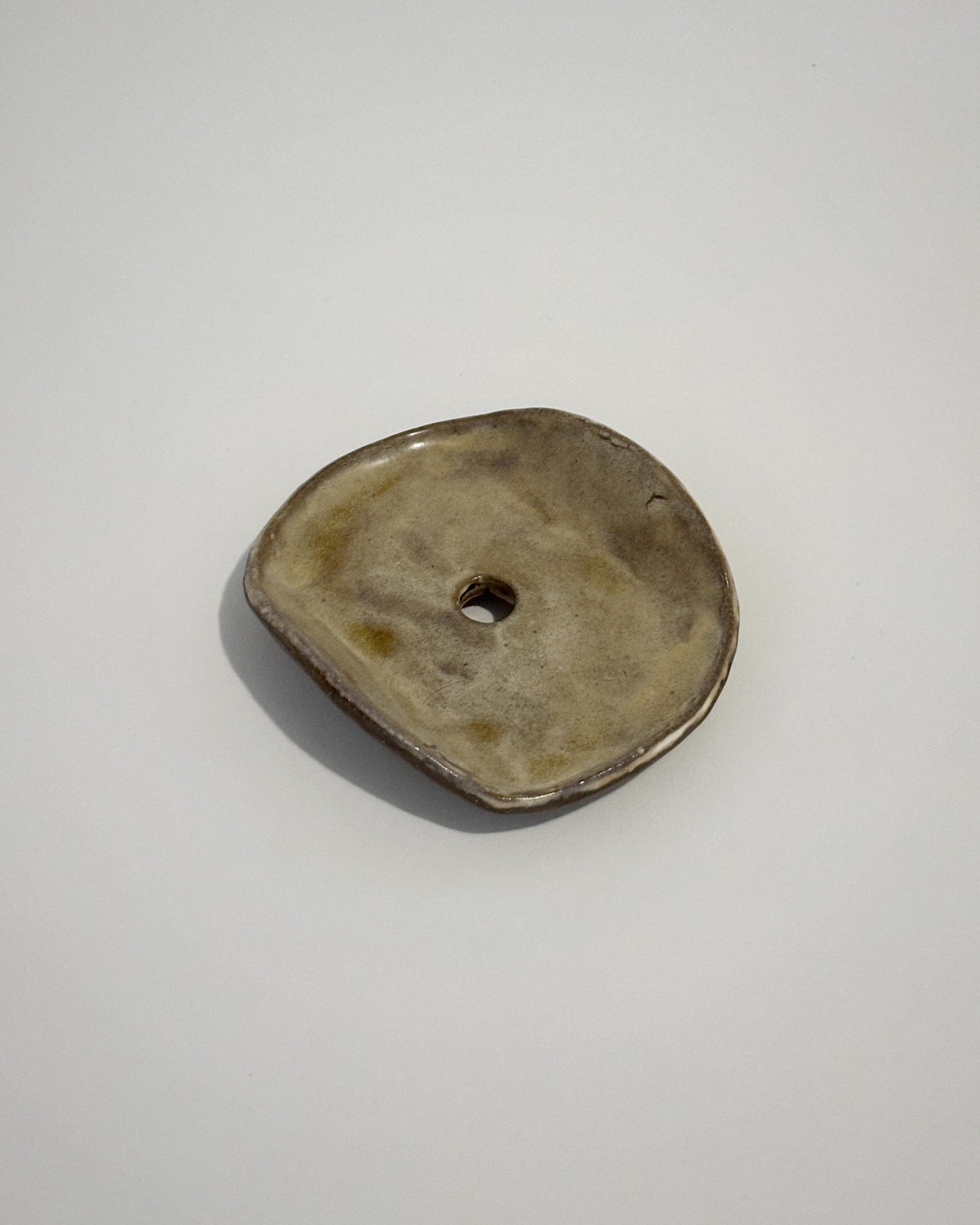 Red clay soap dish glazed in earthy green tones, stamped with LKBK maker’s mark.