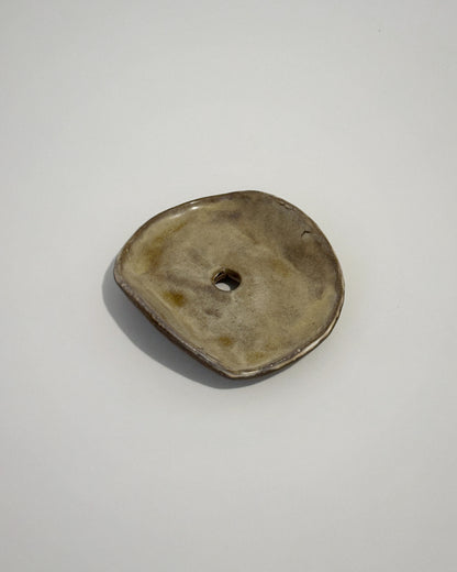 Red clay soap dish glazed in earthy green tones, stamped with LKBK maker’s mark.