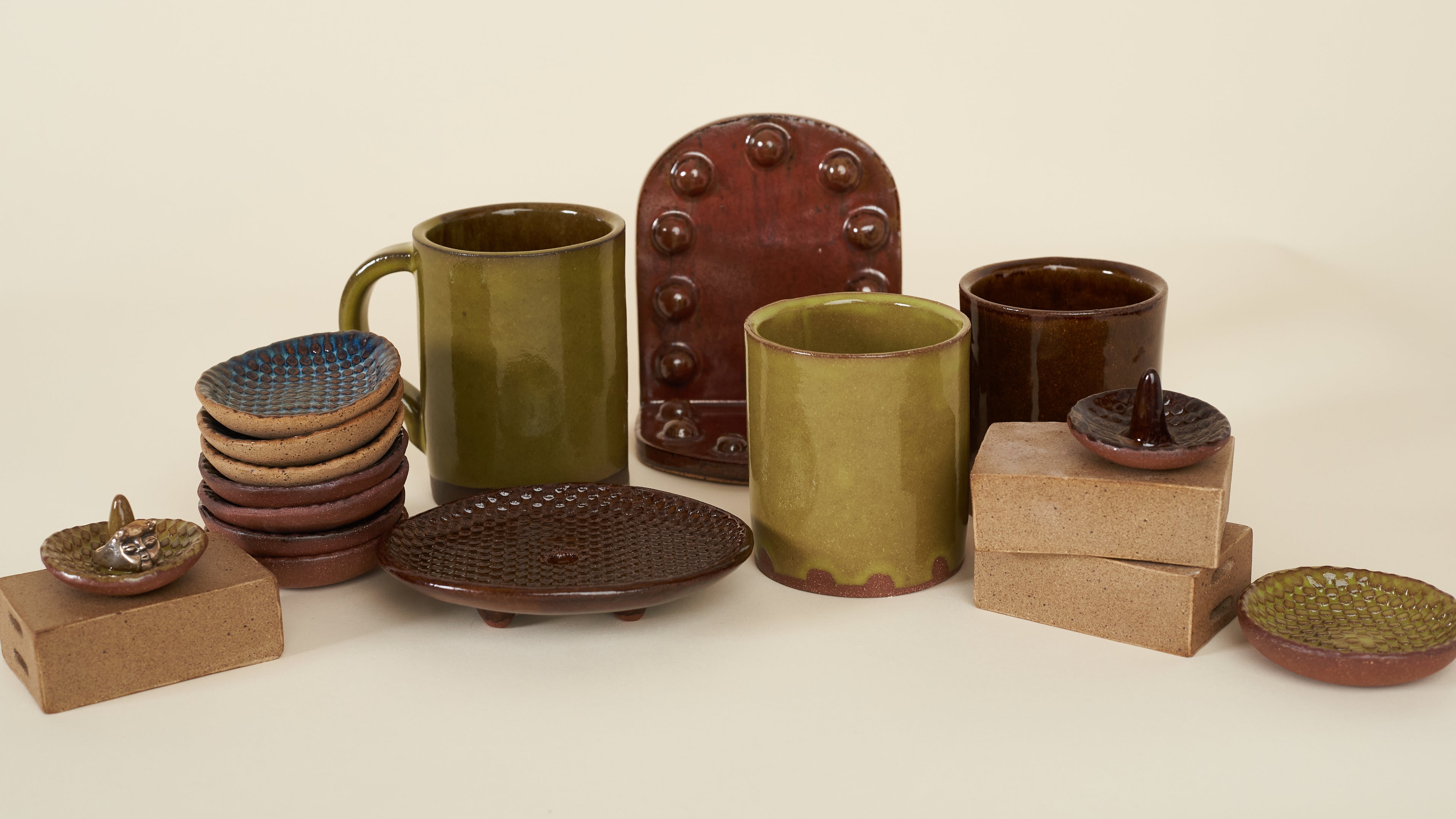 Collection of ceramic and wooden items on a beige background